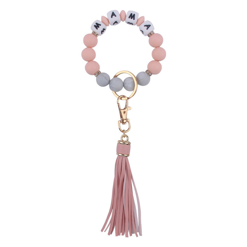 Venta al por mayor Llavero de muñeca con cuentas de estampado de leopardo de silicona